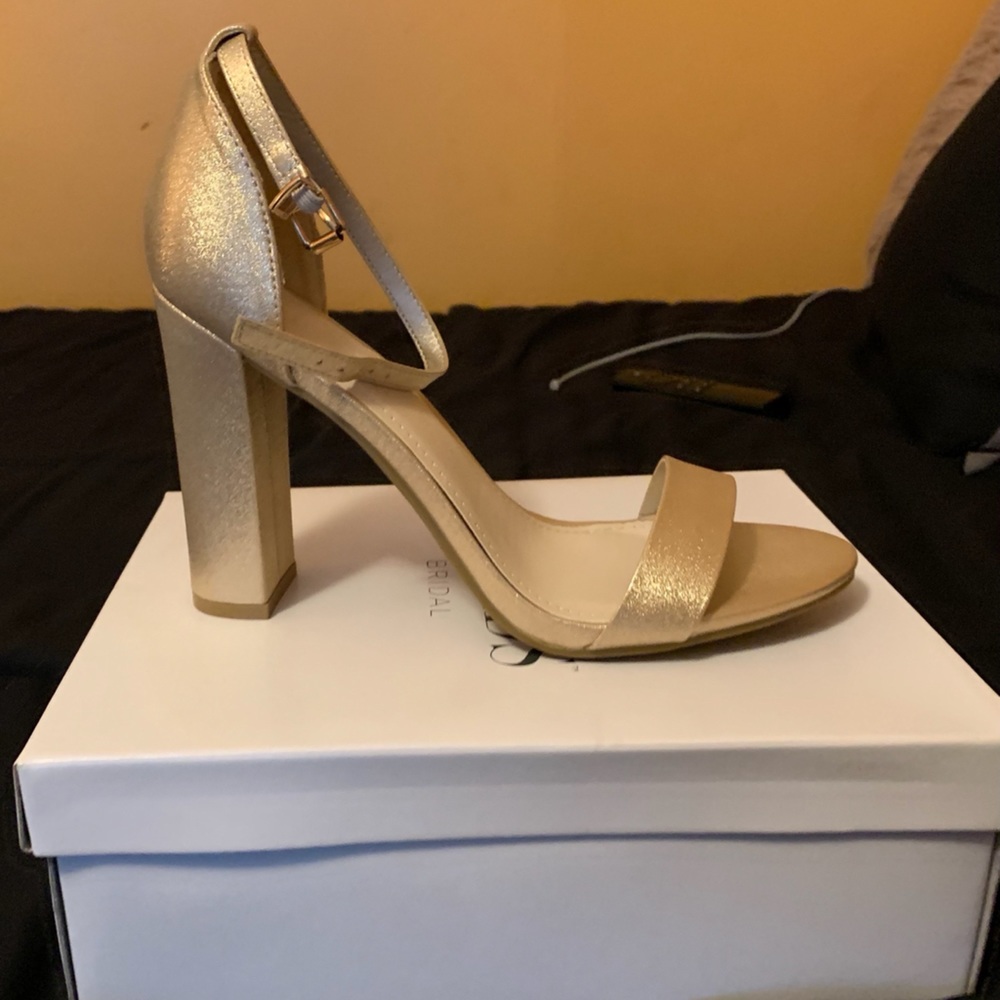 BRAND NEW.  NEVER WORN. Gold strap heels